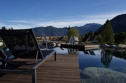 Bamboo decking board around a swimming pool and a lake